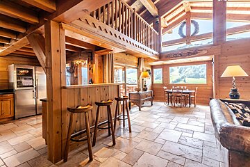 A wooden house with a stainless steel refrigerator