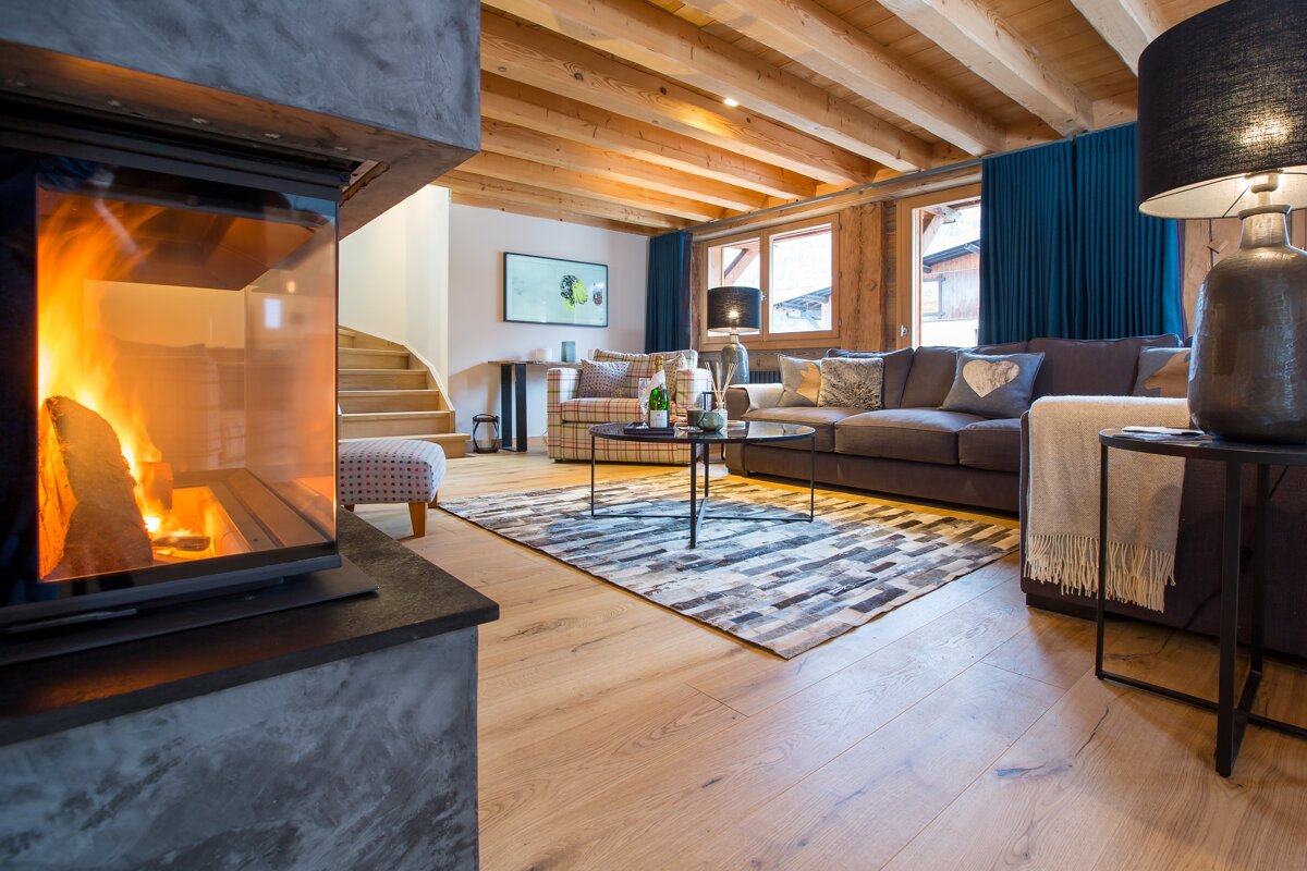 A living room with a fireplace and a couch