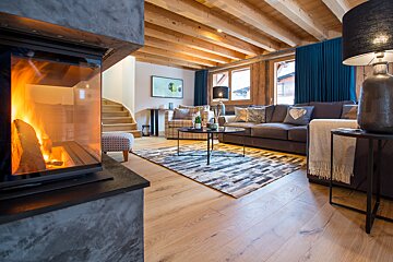 A living room with a fireplace and a couch