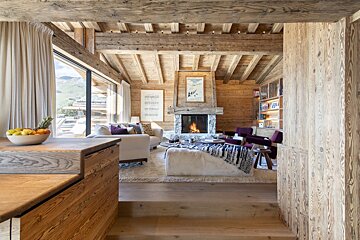 A living room with a fireplace and a couch