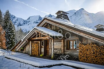 A snowy cabin with the number 80 on the roof