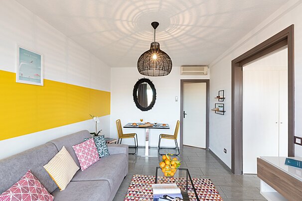 A living room with a couch and a table