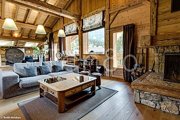 A living room with a couch a coffee table and a fireplace taken by ten80 holidays
