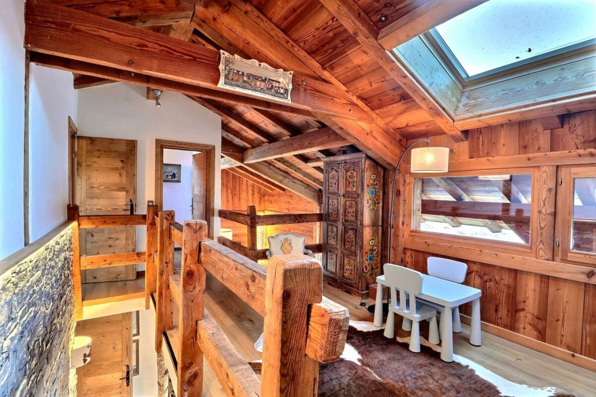 A wooden staircase leading up to the second floor of a house