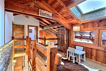 A wooden staircase leading up to the second floor of a house