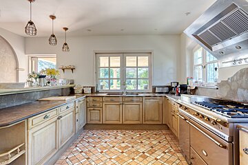 A kitchen with stainless steel appliances and wooden cabinets