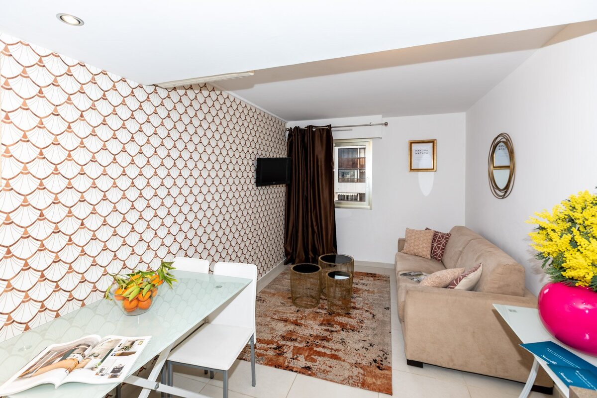 A living room with a couch and a table