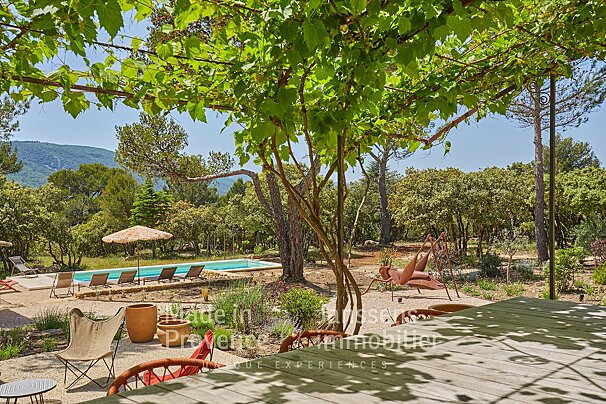 A picture of a swimming pool with the words made in provence on the bottom