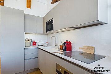 A bedroom with a towel rack on the wall
