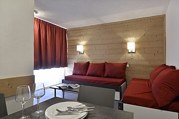 A living room with a couch and a table