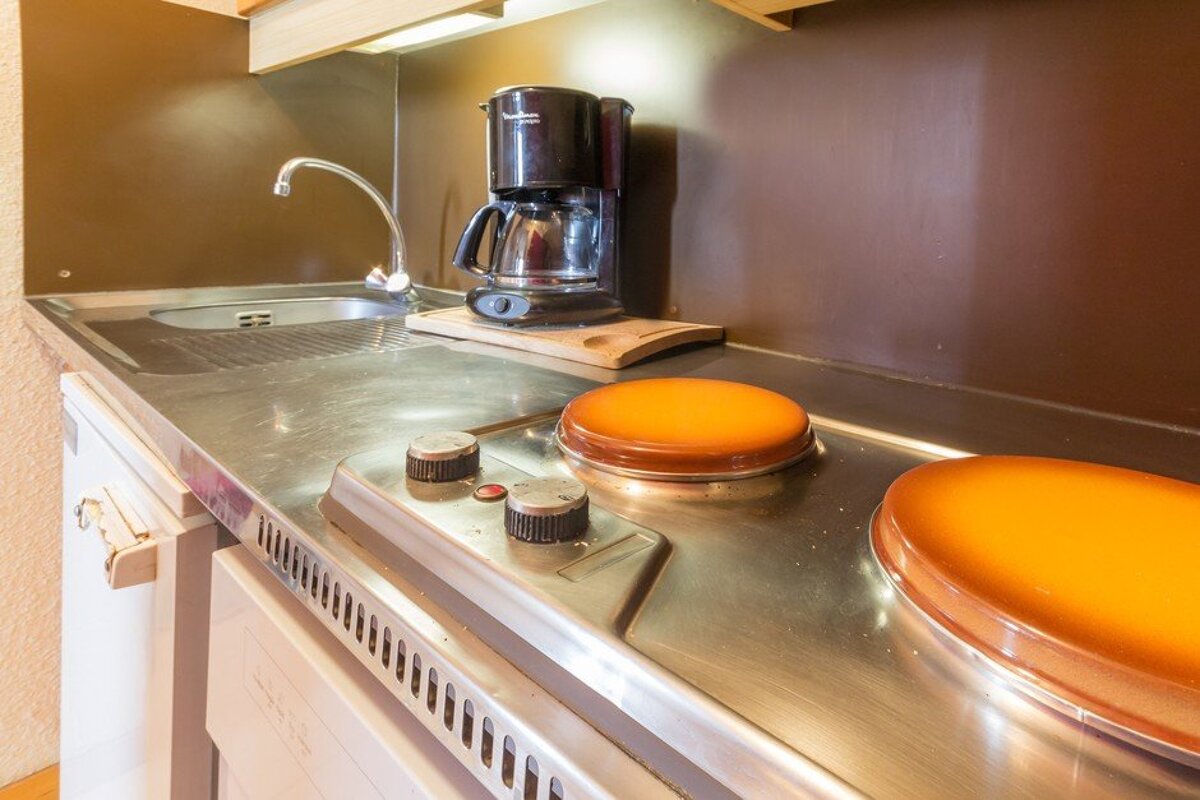 A moulinex coffee maker sits on a kitchen counter