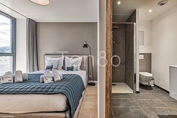A bedroom with the number 80 on the wall