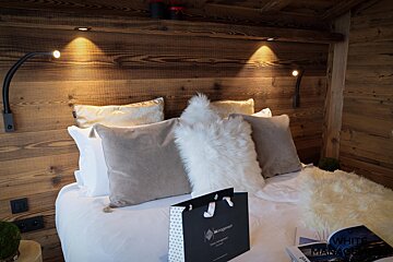 A bed with a bag that says aeropostale on it