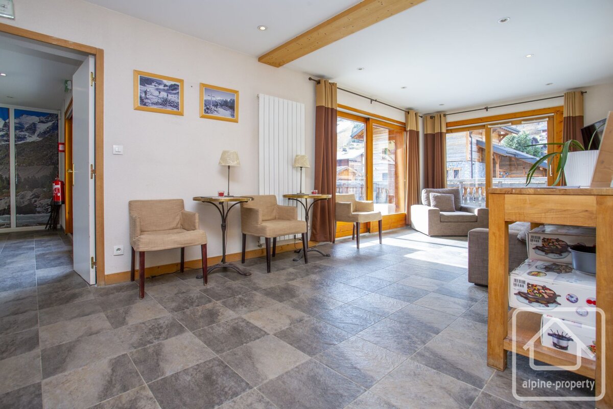 A picture of a living room with alpine property written on the bottom