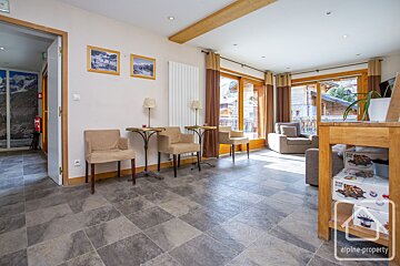 A picture of a living room with alpine property written on the bottom