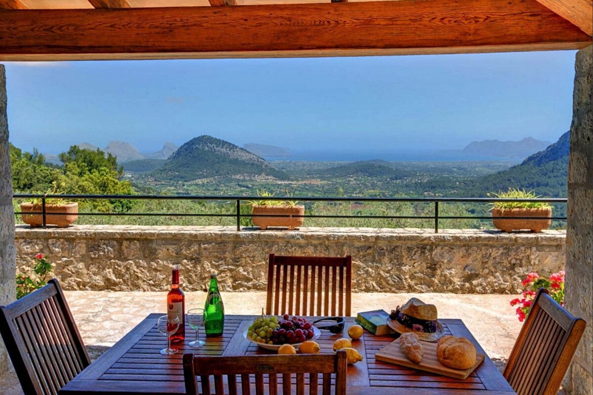 A table with a bottle of red wine on it