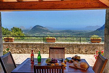A table with a bottle of red wine on it