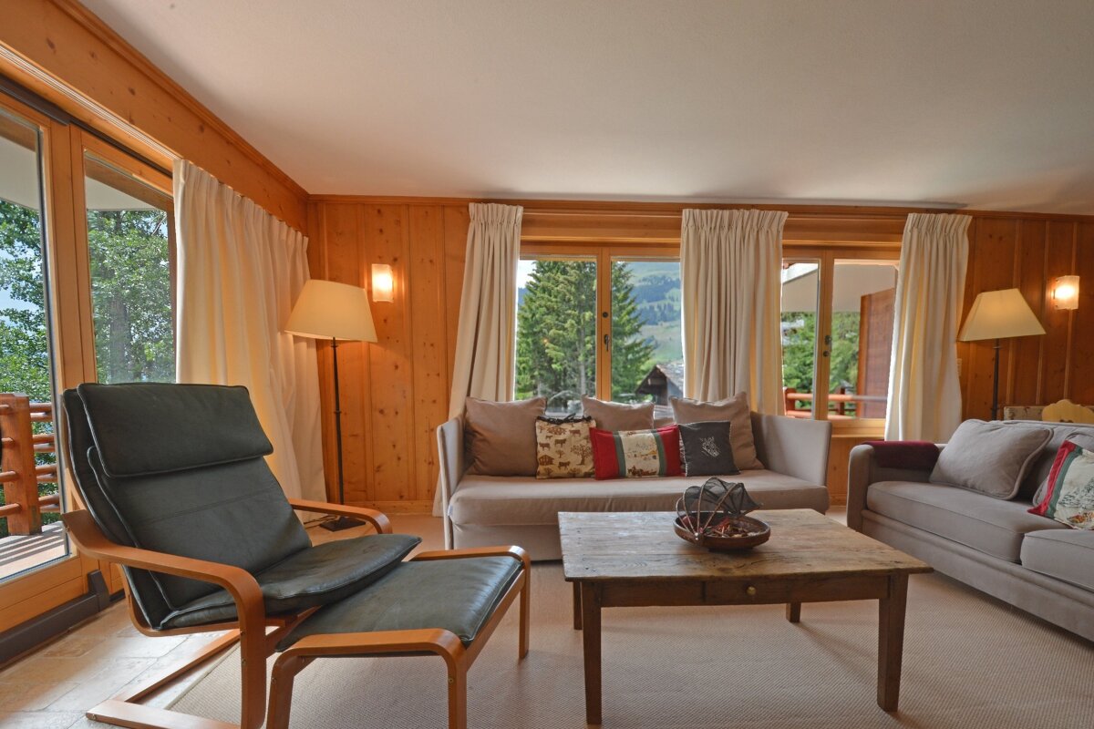 A living room with a couch and a chair