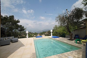 A large swimming pool with a view of the mountains