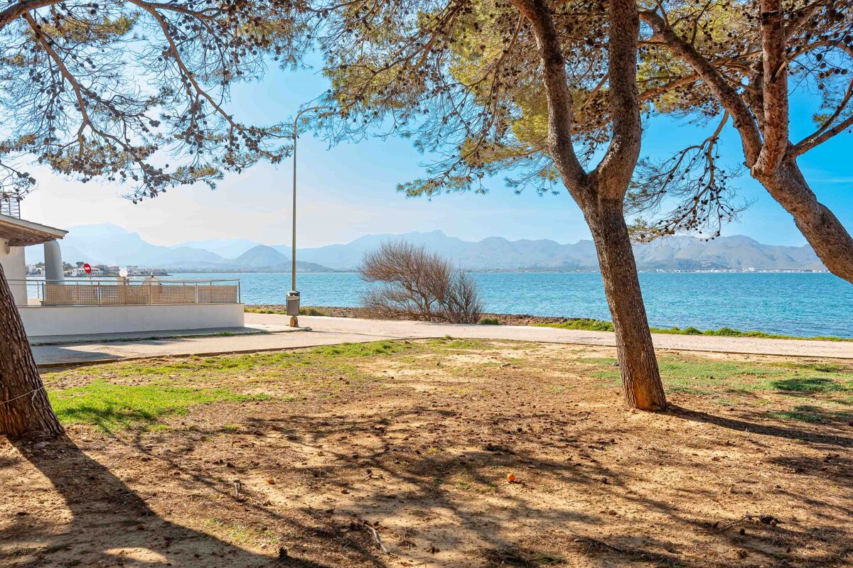 A view of a body of water with mountains in the background