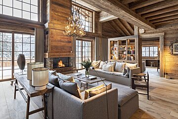A living room with a couch and a fireplace