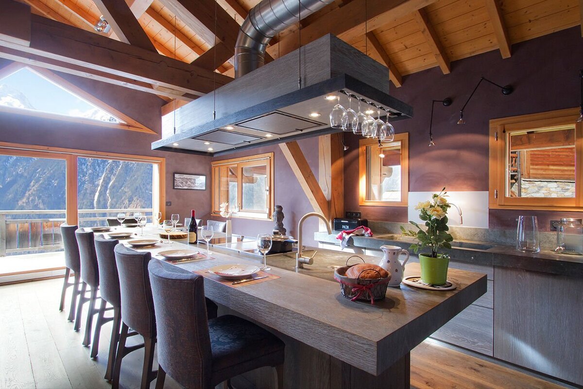 A kitchen with a large island and a wine rack