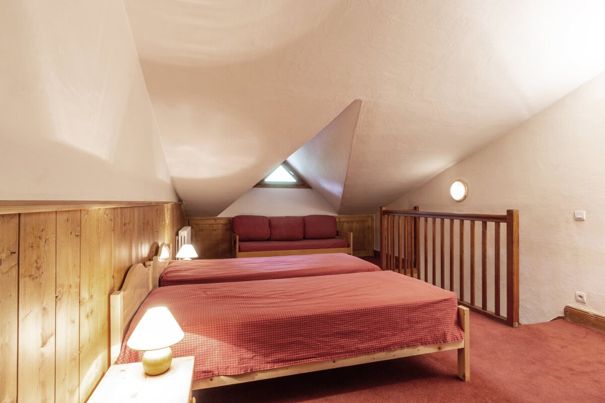 A kitchen with wooden cabinets and stainless steel appliances