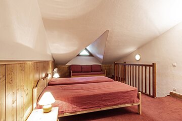 A kitchen with wooden cabinets and stainless steel appliances