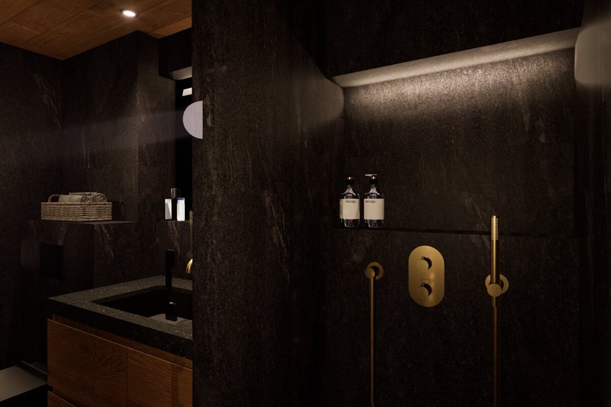 A bathroom with a sink and two soap dispensers on the wall