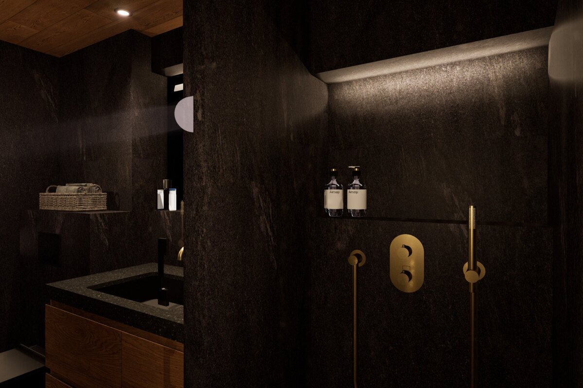 A dark, luxurious bathroom with black textured walls, featuring a gold shower, backlit toiletries, and a wooden vanity. Modern elegance.
