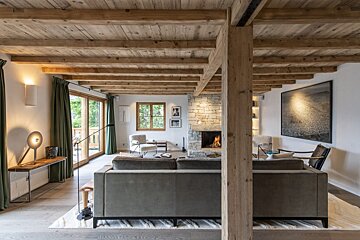 A living room with a couch and a fireplace