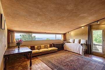 A living room with a couch and a rug