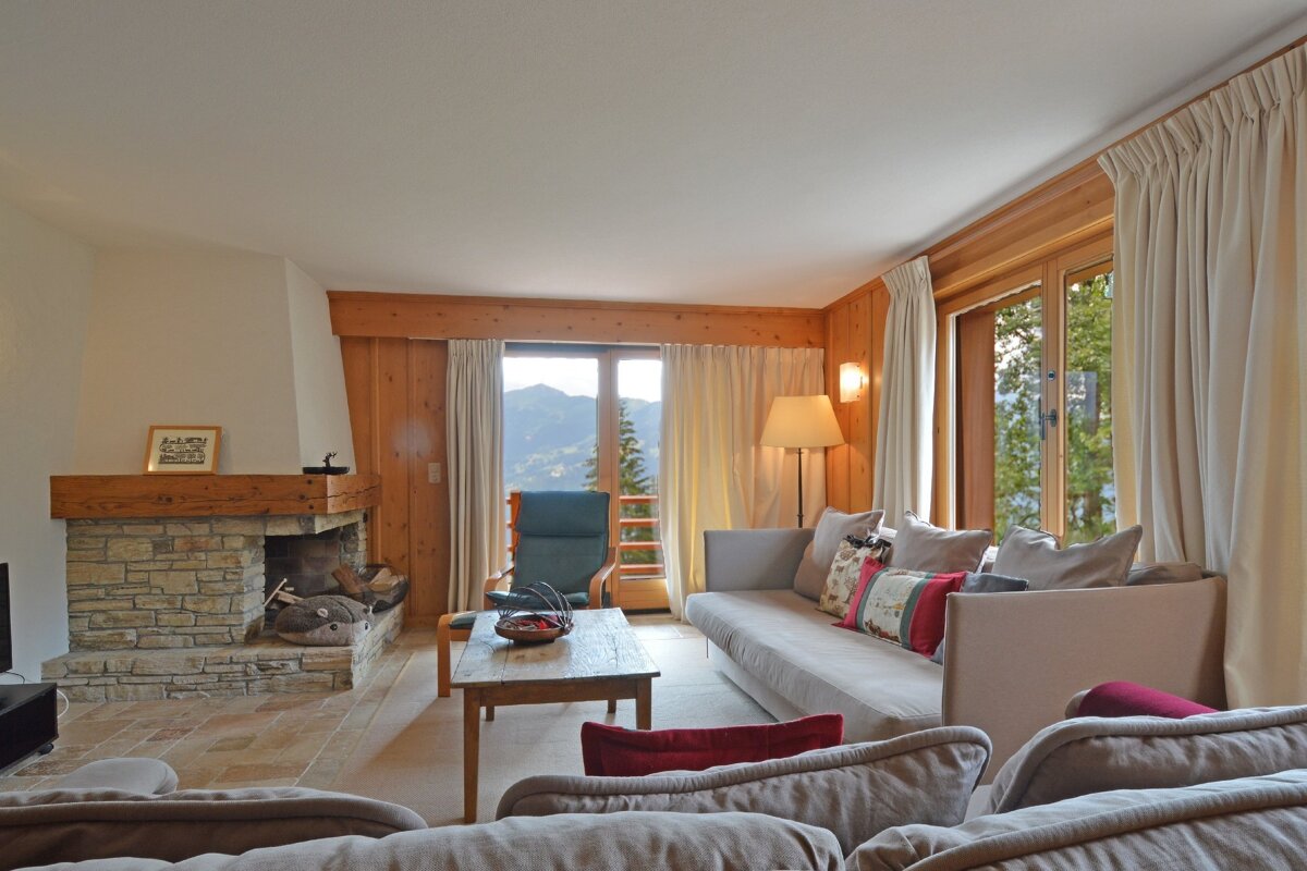 A living room with a fireplace and a couch