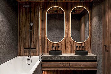 A modern, stylish bathroom featuring dark wood paneling, textured stone walls, a bathtub, and a double vanity with backlit oval mirrors and black basins.