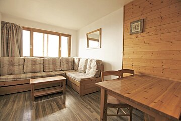 A living room with a couch and a table