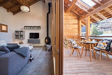 A living room with a couch and a television