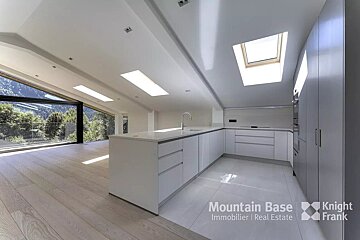 A kitchen with a skylight and the words mountain base on the bottom