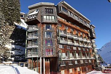 A large building with a lot of windows and balconies