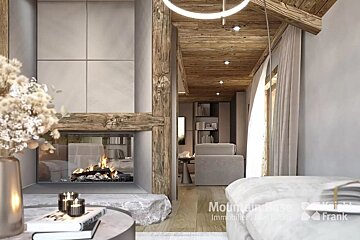 A stylish, warm living space featuring a modern glass fireplace with a roaring fire, rustic wooden ceiling and beams, and soft, neutral decor.