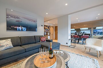 A living room with a pillow that says pister on it