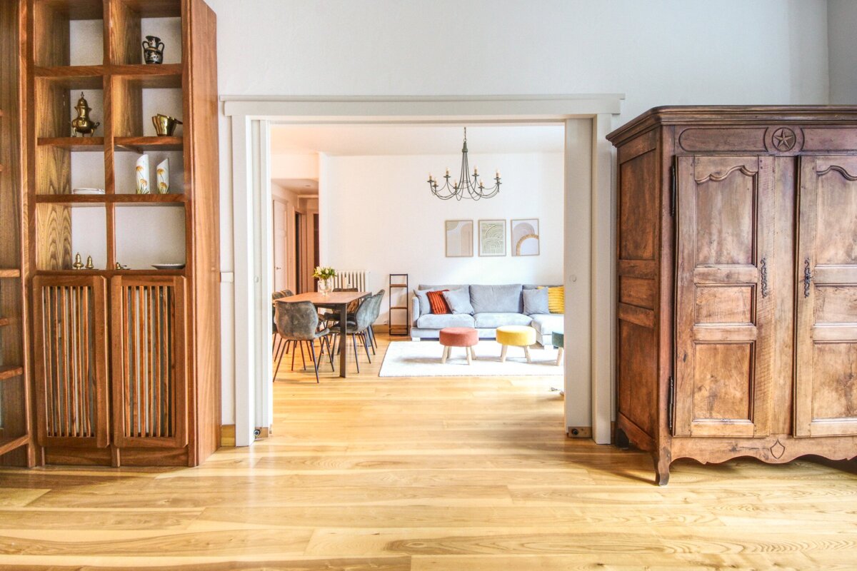 A living room with a couch and a dining table