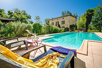 A pool with a purple towel that says