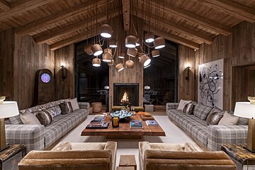 A living room with lots of furniture and a fireplace