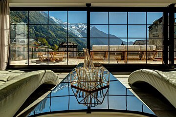 A living room with a view of the mountains