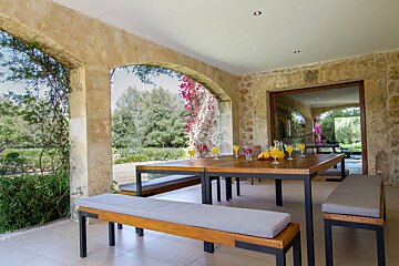 A table with glasses of orange juice on it