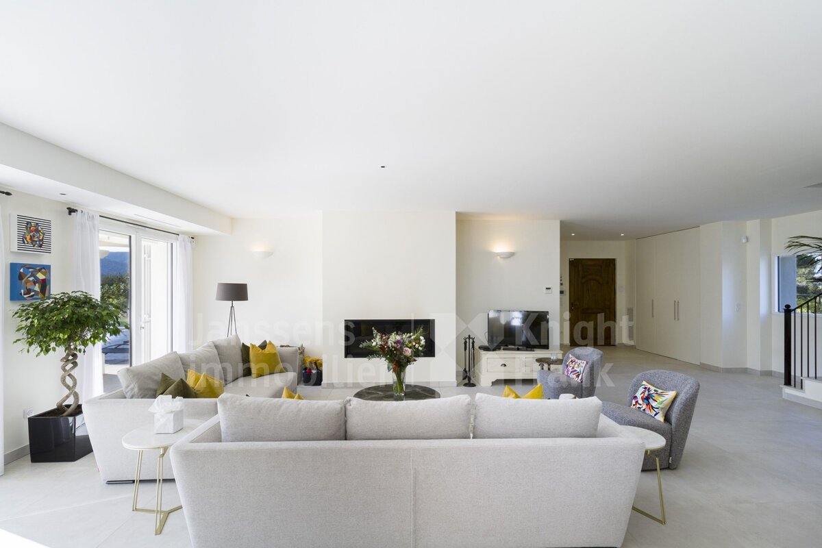 A living room with a couch and a fireplace and a sign that says knight