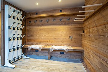 A boot drying rack with a sticker that says ' bosch ' on it