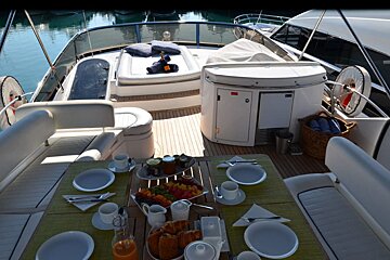 A boat has a table set with plates and utensils