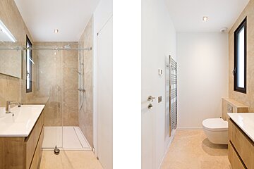 A bathroom with a walk in shower and a toilet