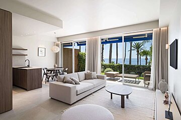 A living room with a couch and a table